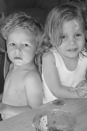 Max and Maddie eating salsa (black and white)